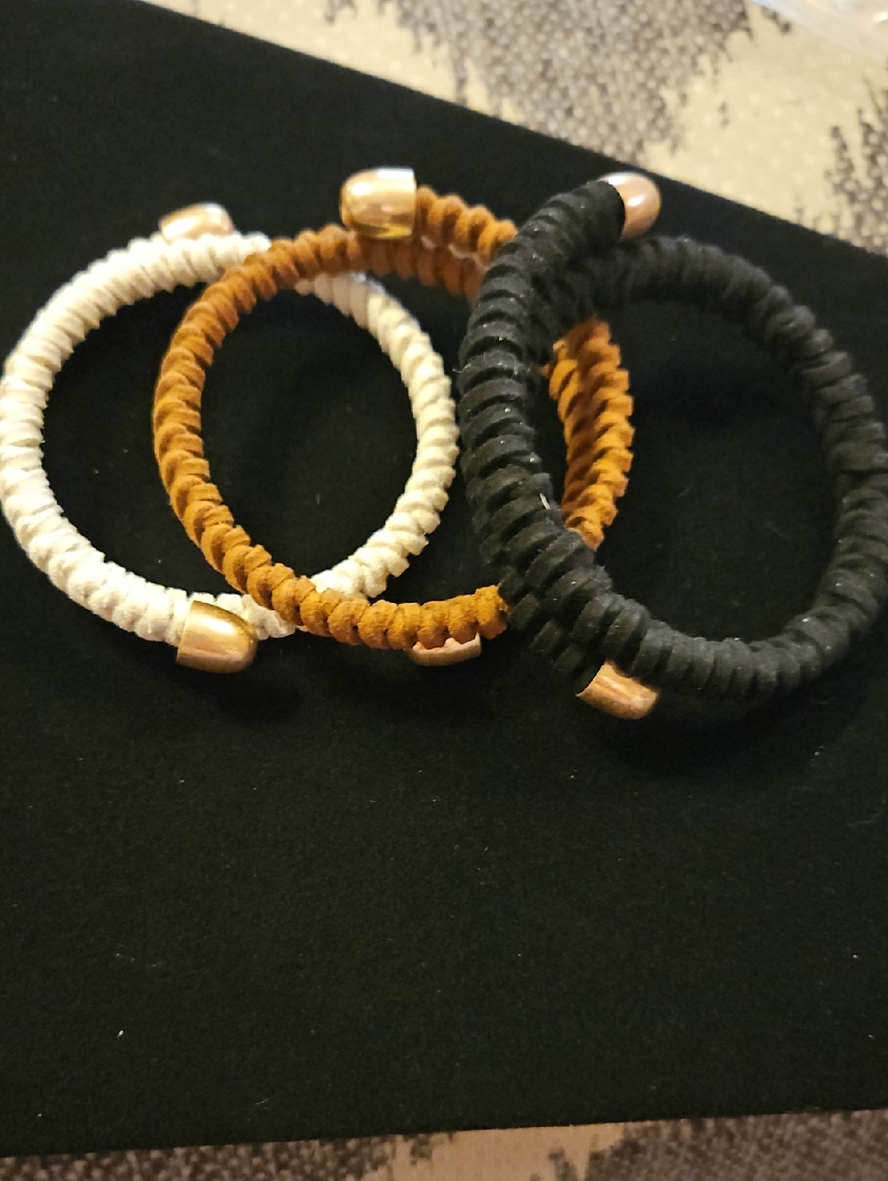 Set of 3 Faux Leather Cuff Bracelets in Black, Tan, and Cream